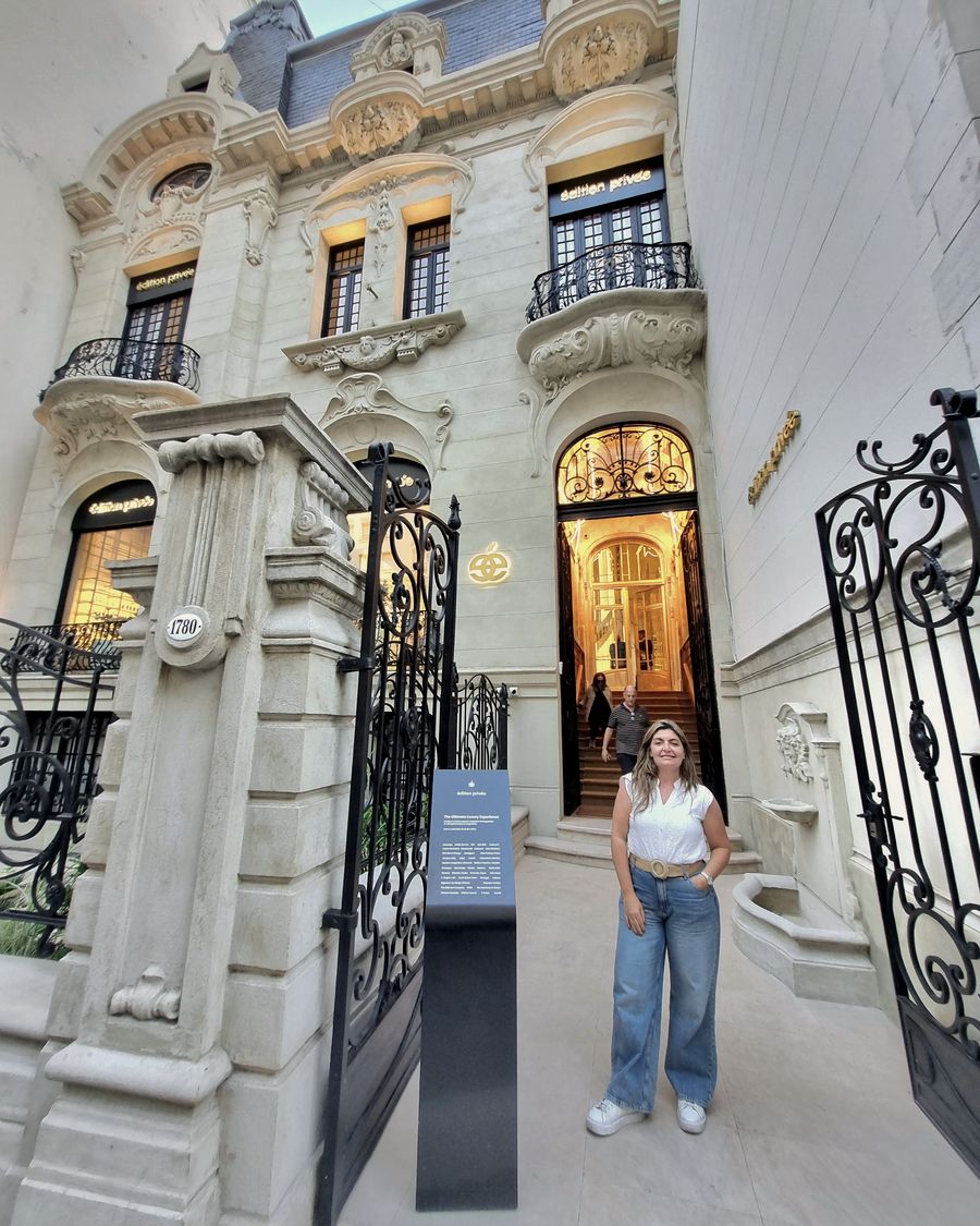Adriana Kaprielan standing in front of the restored Belle Époque facade of the former Residencia Lloubet on Avenida Alvear, Buenos Aires