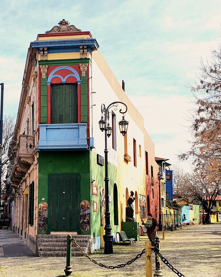 Colorful corner building with balcony in Caminito, La Boca, Buenos Aires