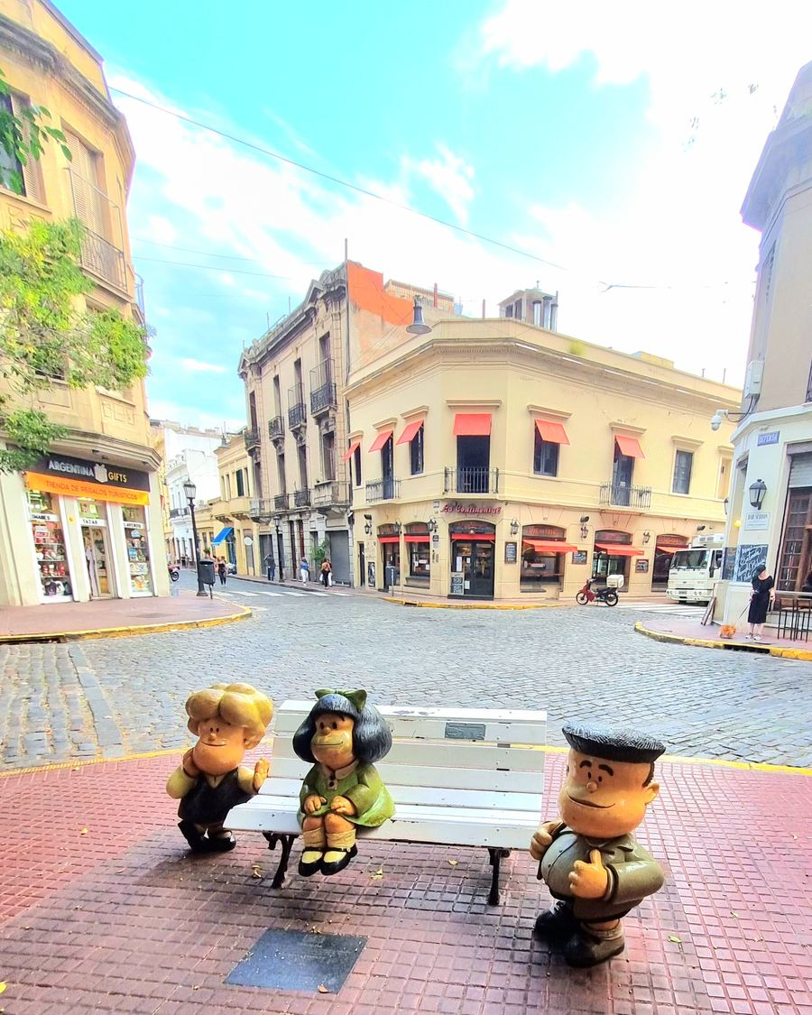 Mafalda comic strip characters on a bench along the Comic Strip Walk, San Telmo