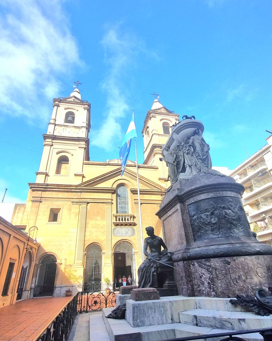 Historic San Telmo church with statue in the foreground