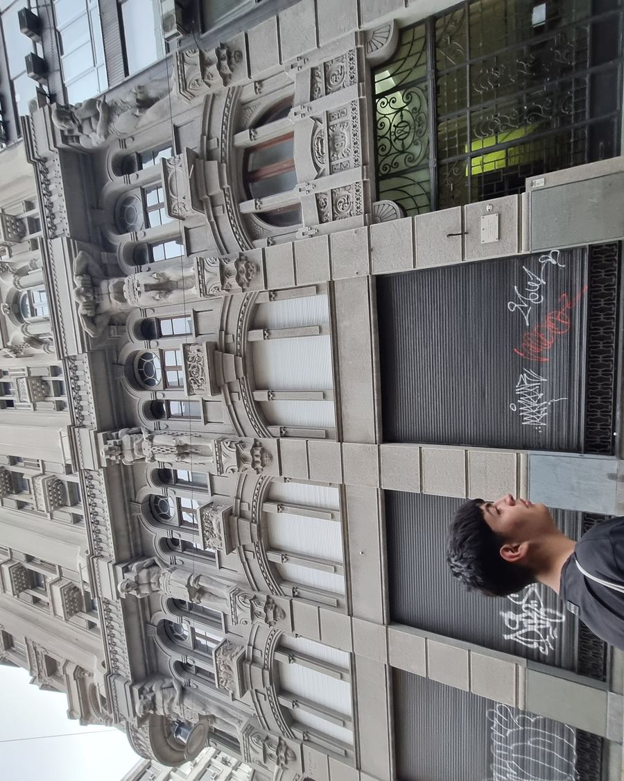 Ornate building facade with atlas sculptures in San Telmo
